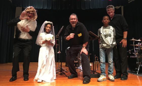 Students participating in one of the skits during an education program.